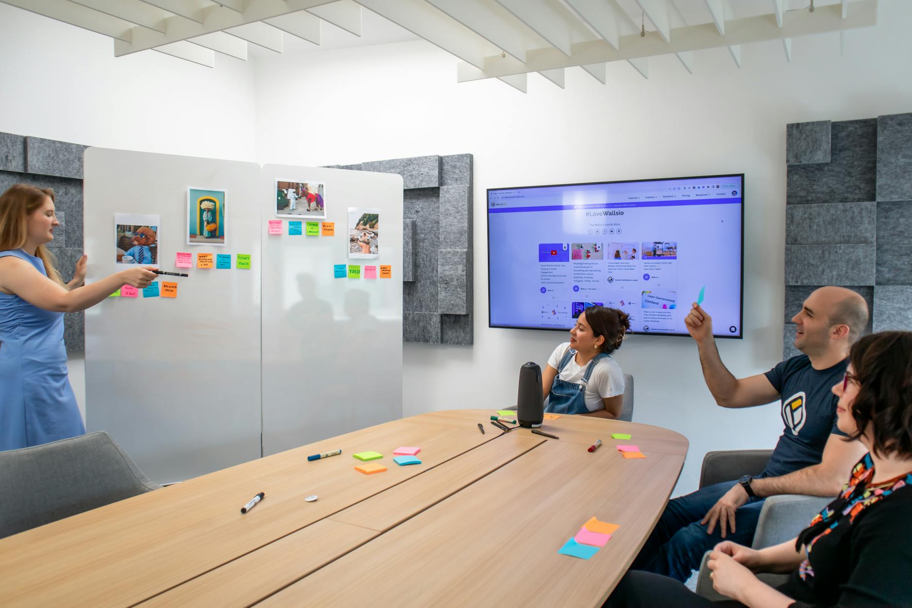 Coworkers engaged in a creative brainstorming session with colorful Post-it notes