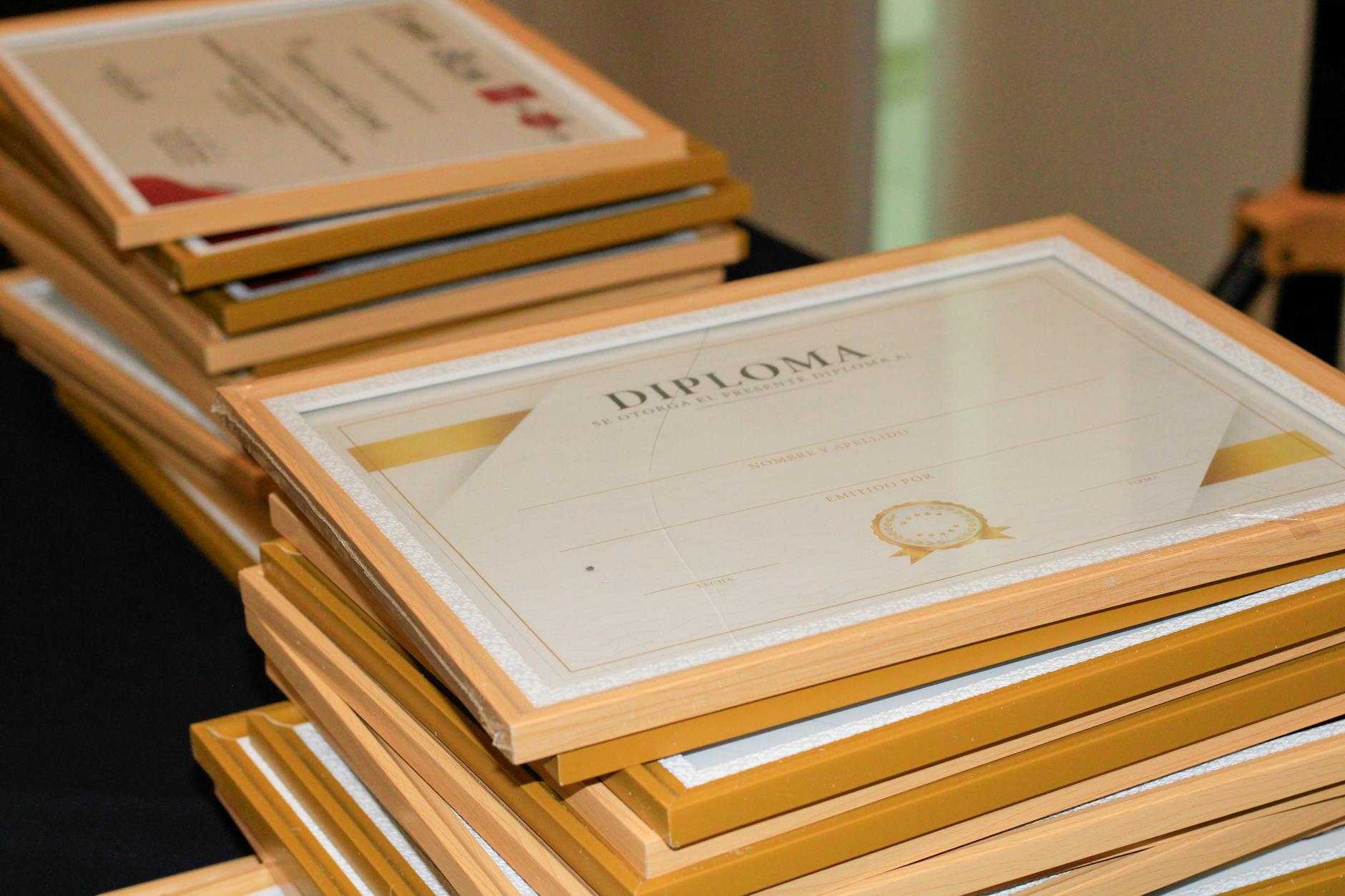 A stack of elegant framed diplomas prepared for an academic ceremony