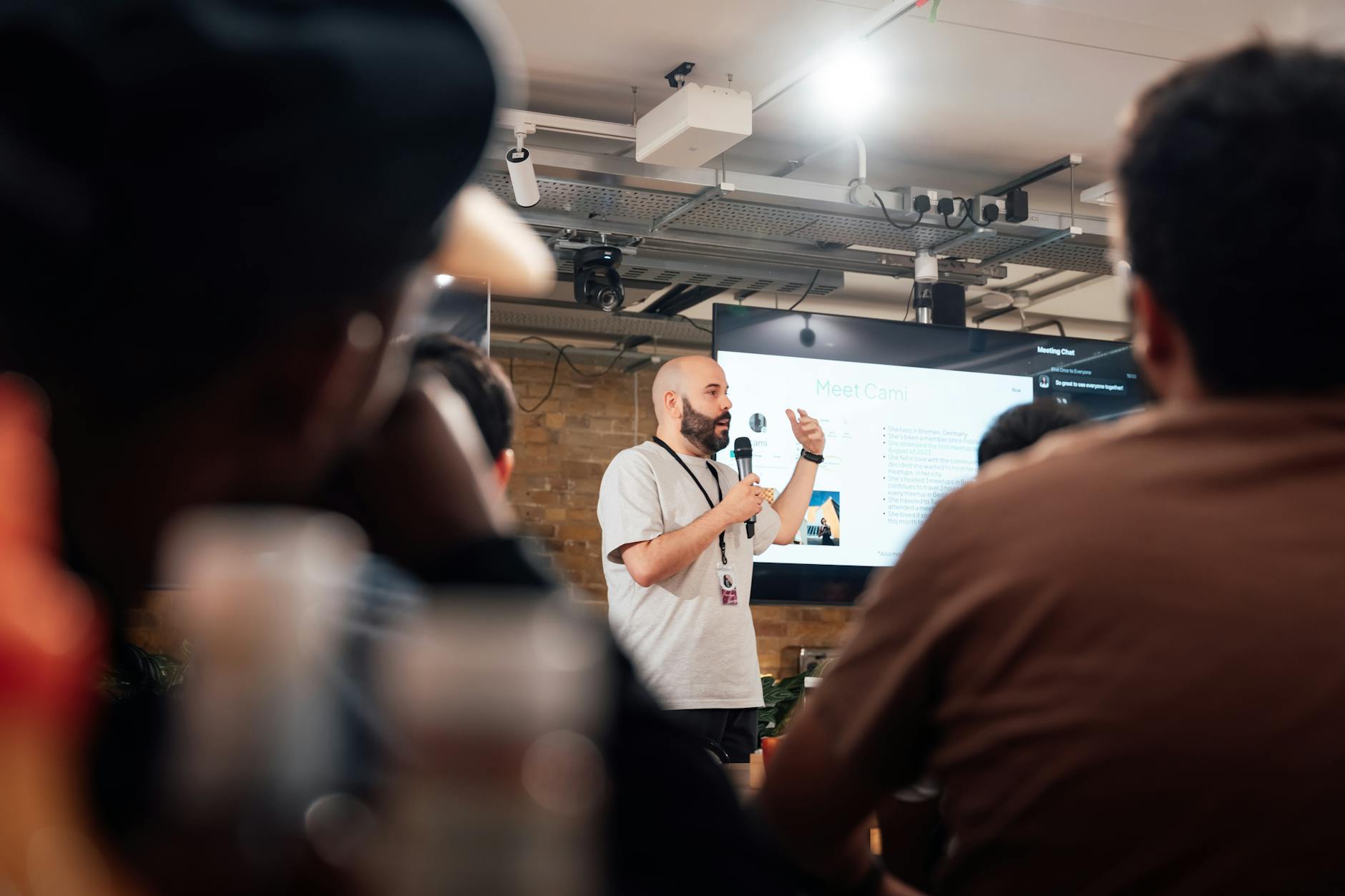 An engaging speaker presenting to an attentive audience during a tech event
