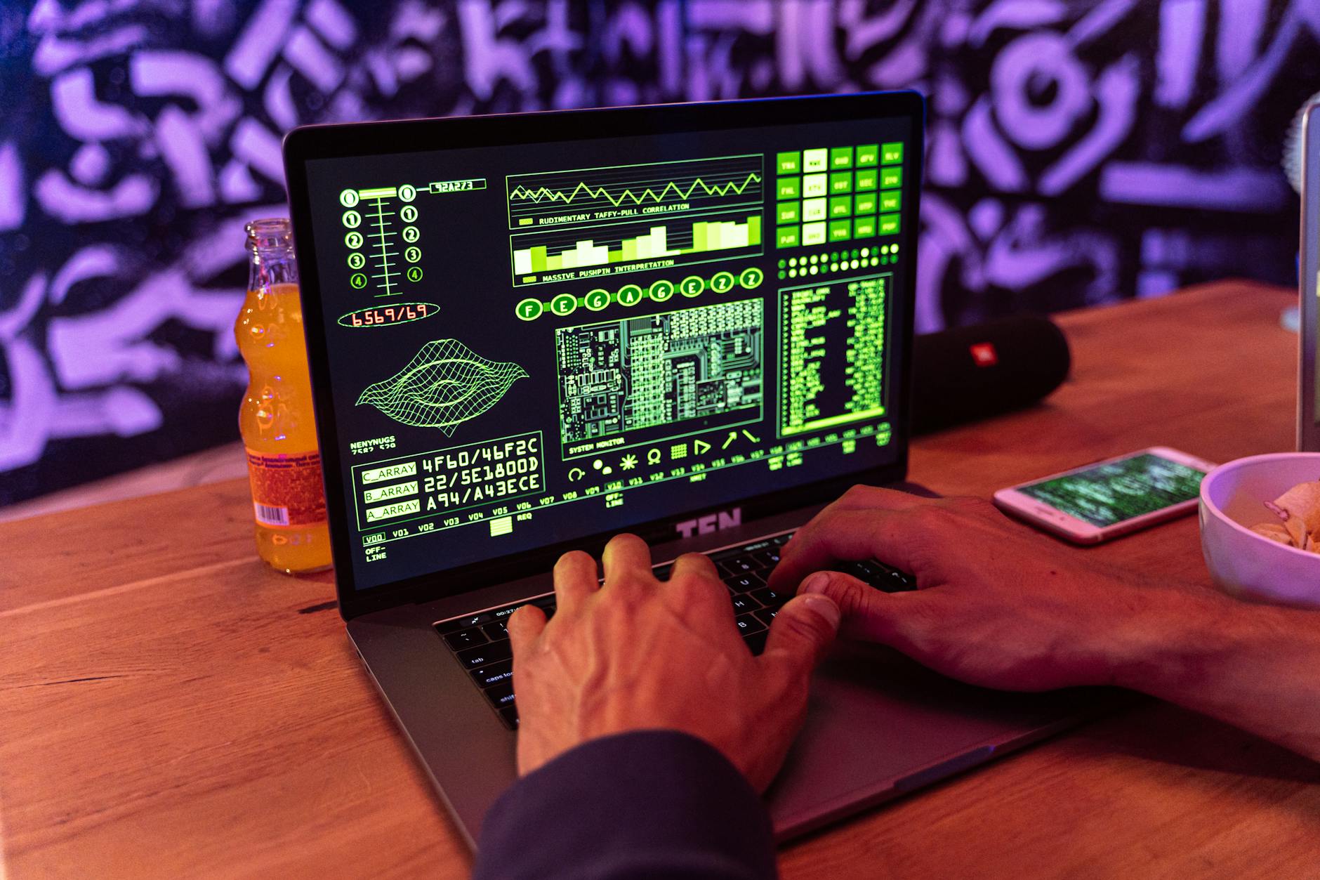 A person typing on a laptop displaying green code, focused on a CTF challenge