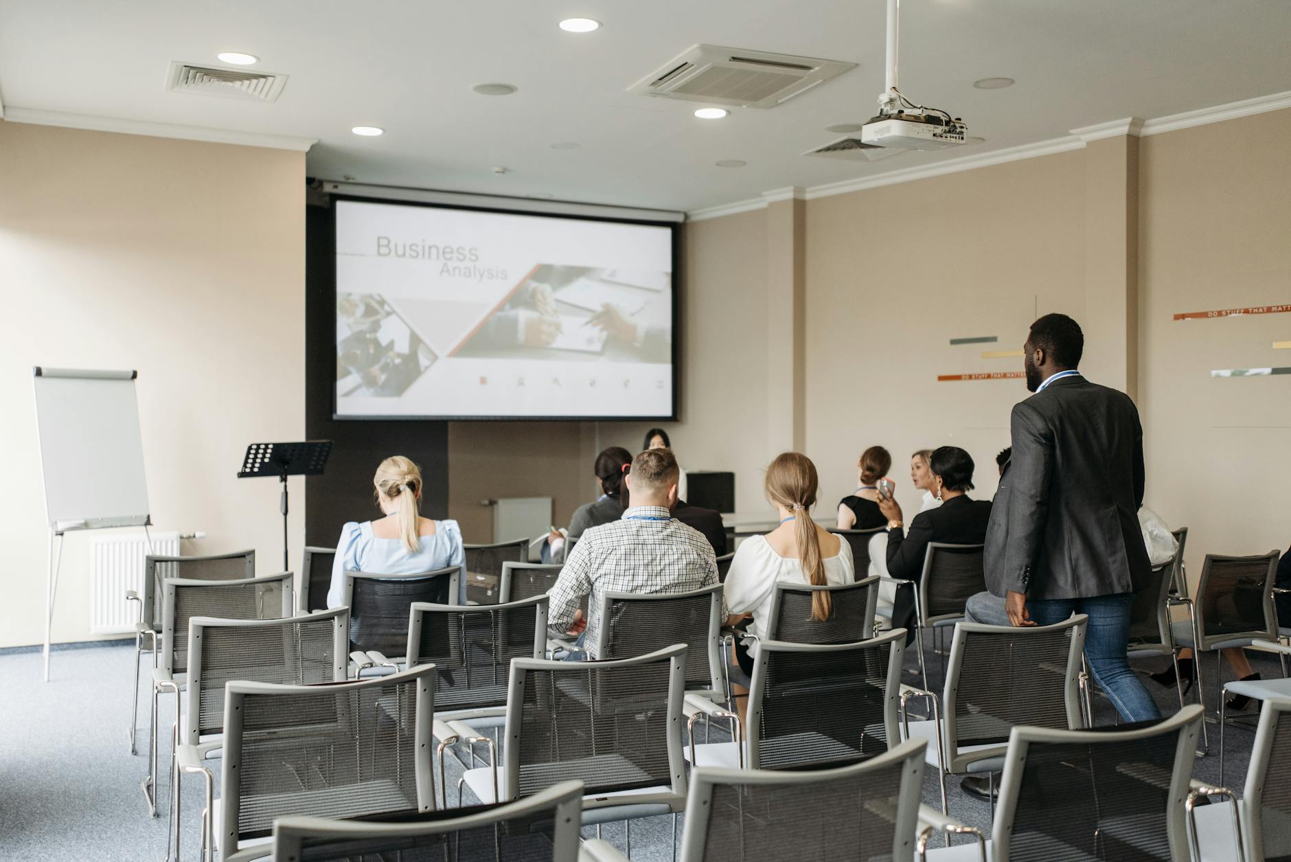 Business conference attendees listening to a presentation