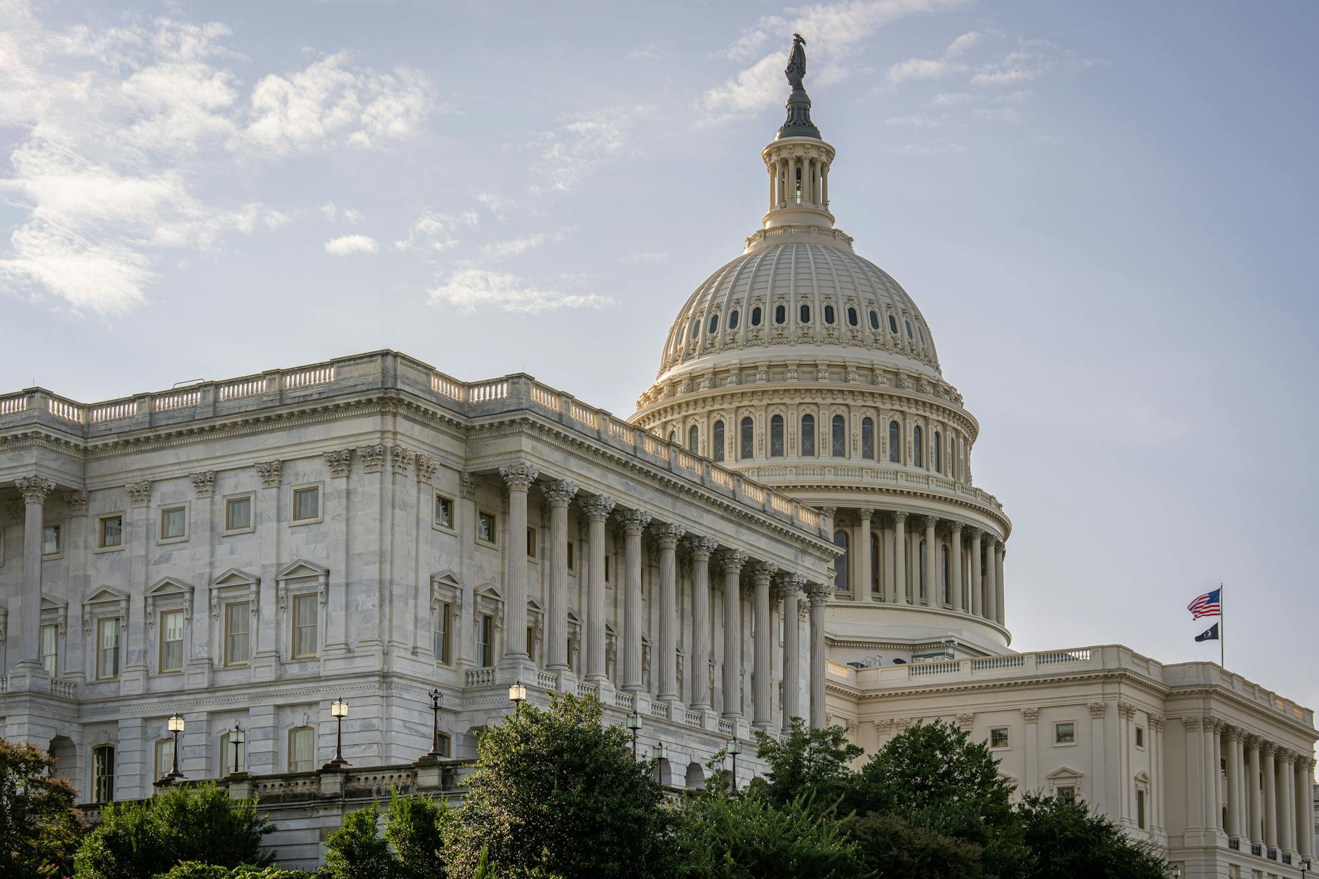 The US Capitol Building under a clear blue sky